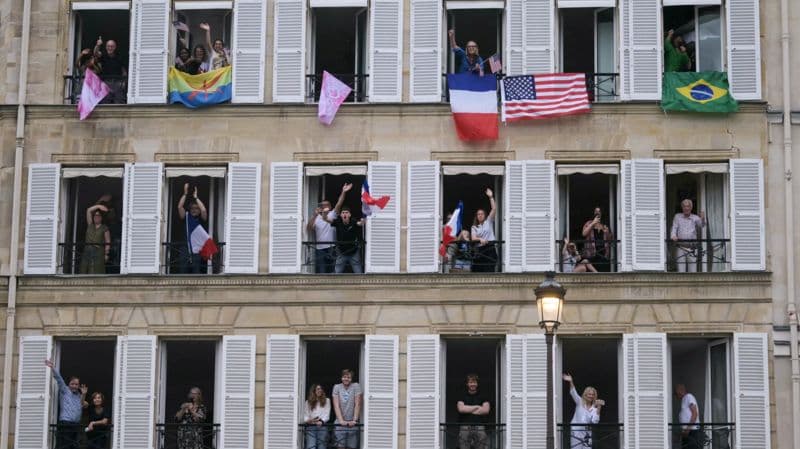 People watching the Olympics from their balconies